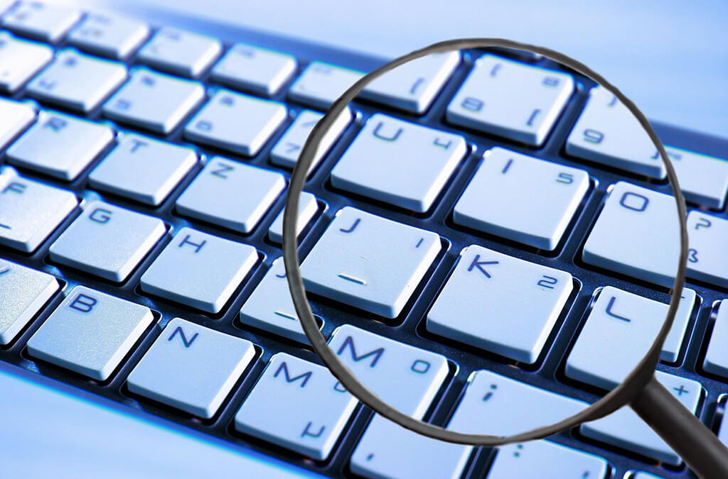 Microscope narrowing down on computer keyboard